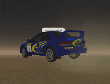 a subaru rally car with the number 3 on it