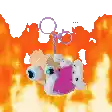 a stuffed animal is hanging from a rope in front of a flame .