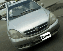 a silver car with a tag that says ethio