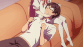 a man is laying on a couch with a woman 's legs behind him