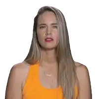 a woman wearing an orange tank top and a necklace with the name brunel