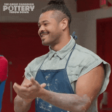 a man wearing an apron is clapping in front of a poster that says the great canadian pottery throw down