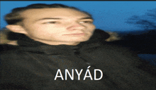 a blurry picture of a man with the word anyad on the bottom right