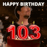 a birthday cake with candles in the shape of the number 103