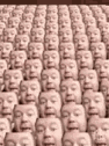 a bunch of people 's faces are lined up in rows .