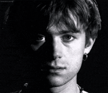 a black and white photo of a man 's face with the name daronal bark written on the bottom