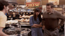 a man and a woman are standing in a grocery store with the words " would you like " above them