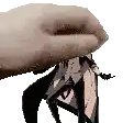 a hand is holding a person 's head in a pixelated image .