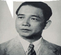 a black and white photo of a man in a suit