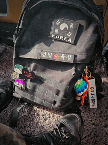 a backpack with a korea patch on it