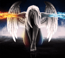 a woman with angel wings is kneeling down with fire and water coming out of her arms