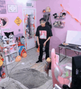 a man in a room with a sign that says sheep are king on it