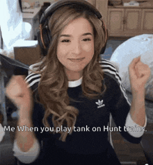 a woman wearing headphones with the words " me when you play tank on hunt train "