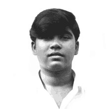 a black and white photo of a young man with short hair