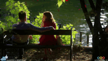 a man and a woman sit on a bench in front of a lake with the words like it on the bottom right