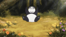 a panda bear is sitting in the grass with its arms up