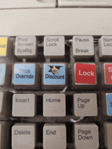 a close up of a keyboard showing a price override key