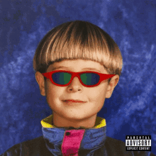 a picture of a child wearing red sunglasses has a parental advisory label