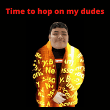 a man wearing a jacket that says time to hop on my dudes on it