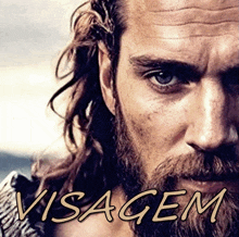 a close up of a man 's face with the word visagem written above him