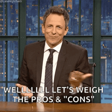 a man in a suit and tie is saying welllll let 's weigh the pros and cons