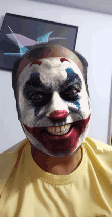 a man with his face painted like the joker