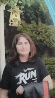 a young woman wearing a black shirt that says run