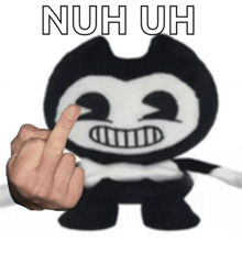 a person is giving a middle finger to a stuffed animal that says nuh uh