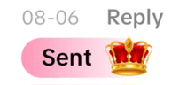 a pink reply button with a red crown on it