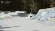 a man is riding a skateboard down a ramp at a skate park with the gem logo in the background