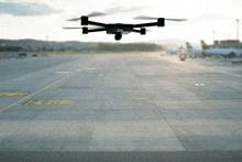 a drone is flying over an airport runway with the letter z on the bottom