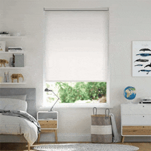 a bedroom with a picture of whales hanging on the wall