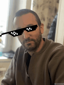 a man with a beard wears sunglasses that say photofunny on the bottom