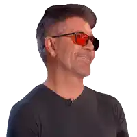 a man wearing sunglasses and a black shirt smiles for the camera