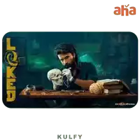 a man is sitting at a table with a skull on it and the word kulfy on the bottom right