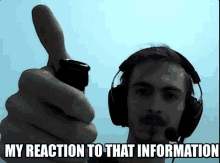 a man wearing headphones is giving a thumbs up with the words my reaction to that information below him