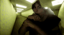 a blurry image of a person in a hallway with arrows on the wall