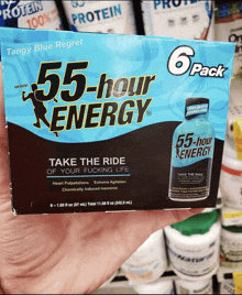 a hand holds a box of 55-hour energy