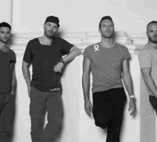 a group of men standing next to each other with one wearing a calvin klein t-shirt