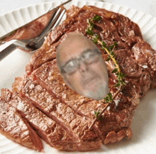 a steak with a picture of a man 's face in the middle