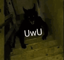 a silhouette of a werewolf standing on a set of stairs with the words uwu on it .