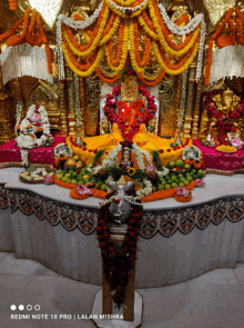 a redmi note 10 pro takes a picture of a temple altar