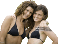 two women in bikinis are posing for a picture