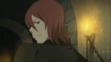 a man with red hair is standing in front of a candle holder
