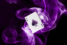 an ace of spades playing card with purple smoke behind it