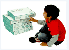 a young boy is reaching for a box that says lokabox.com