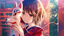 a girl in a red and blue kimono is holding a fox mask