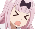 a close up of a cartoon girl with pink hair and a bow on her head making a funny face .