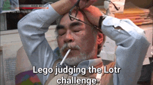 a man smoking a cigarette with the words lego judging the lotr challenge written below him