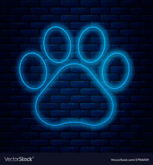 a neon sign of a dog 's paw on a brick wall